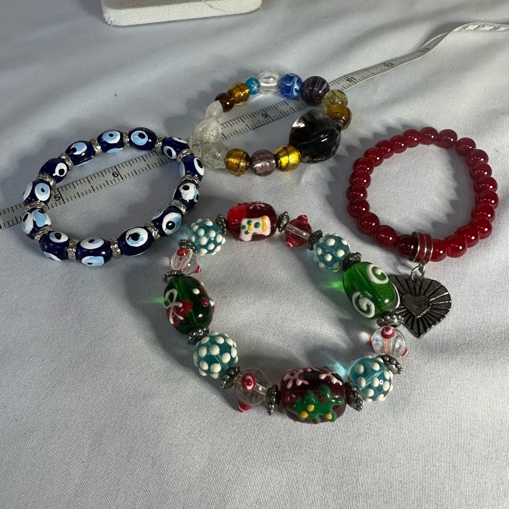 Four glass stretch bracelets